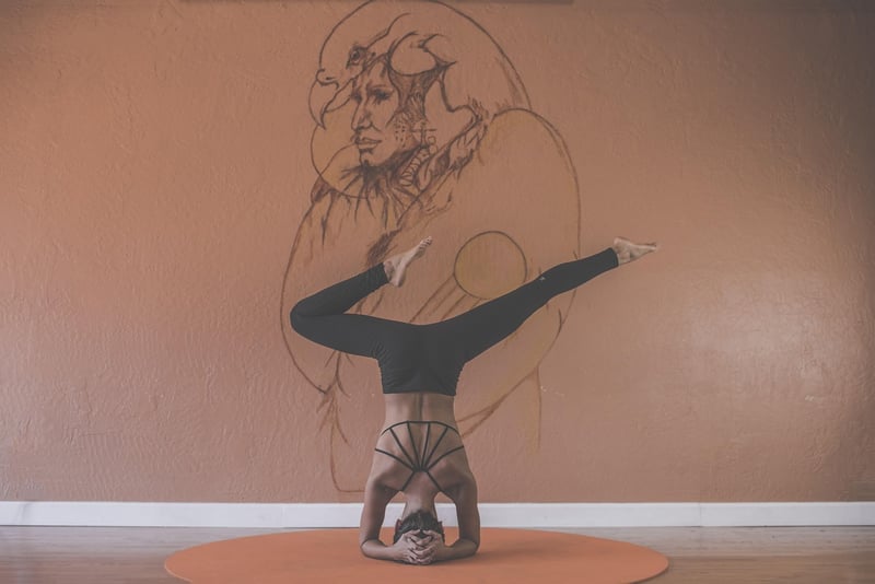 Woman practicing Vinyasa yoga